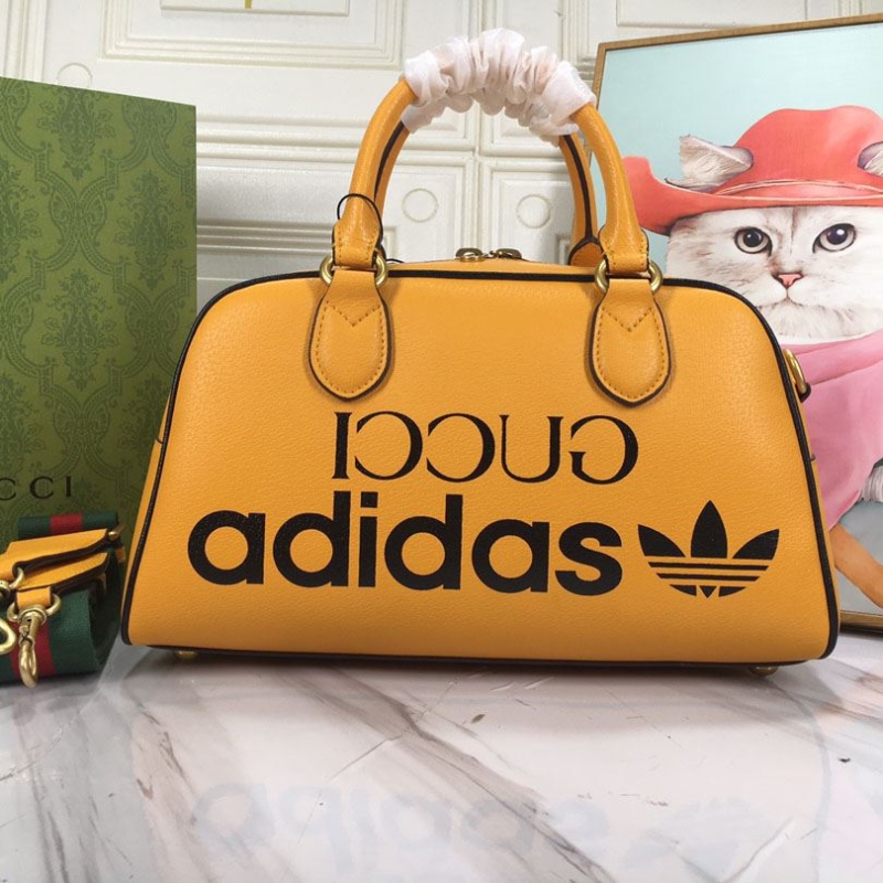 G*u*i top handle bags